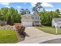 Traditional two-story home featuring a well-maintained lawn and long driveway at 503 Mugo Pine Ct, Wendell, NC 27591