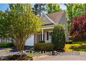 Beautiful end-unit townhome with manicured landscaping and mature trees at 5515 S Roxboro St # 23, Durham, NC 27713