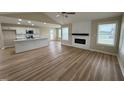 Bright living room with fireplace and seamlessly combines with kitchen at 56 Ruskin Dr, Smithfield, NC 27577