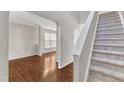 Bright staircase with carpeted steps leading to the second floor at 5609 Severn Grove Dr, Durham, NC 27703