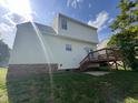 Exterior shot of the back of the house highlighting the back deck at 620 Hanska Way, Raleigh, NC 27610