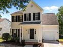 Charming two-story home with black shutters and well-maintained landscaping at 620 Hanska Way, Raleigh, NC 27610
