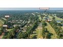 Expansive aerial of townhomes close to #6 Highlands and Prestonwood Country Club, blending community and golf at 703 Kirkeenan Cir, Morrisville, NC 27560