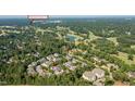Panoramic aerial view of townhomes near Prestonwood Country Club, surrounded by lush greenery and community at 703 Kirkeenan Cir, Morrisville, NC 27560