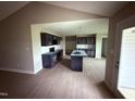 A modern kitchen with an island, navy cabinets, stainless steel appliances and lots of counter space at 72 Ruskin Dr, Smithfield, NC 27577