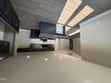 Modern kitchen with dark cabinets, an island, and recessed lighting at 72 Ruskin Dr, Smithfield, NC 27577