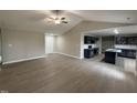 Open-concept living room with a view of the modern kitchen, perfect for entertaining and Gathering gatherings at 72 Ruskin Dr, Smithfield, NC 27577