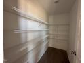 Walk-in pantry with installed metal shelving providing organized space and maximizing storage at 72 Ruskin Dr, Smithfield, NC 27577