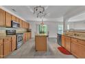 Spacious kitchen featuring stainless steel appliances, granite countertops, and a large island, perfect for cooking at 1198 Shining Water Ln, Creedmoor, NC 27522