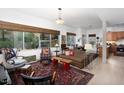 Bright and airy living room with large windows, hardwood floors, and an open floor plan at 130 Hunt St # 107, Durham, NC 27701