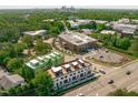 Stunning aerial view of the property showcasing its prime location near the city and surrounding greenspace at 1302 Chamblee Hill Ct, Raleigh, NC 27608