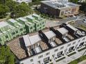 Aerial perspective of new construction showcasing modern townhomes with rooftop patios and stylish design at 1302 Chamblee Hill Ct, Raleigh, NC 27608