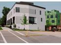 Modern home with white brick, large windows, and street view at 1302 Chamblee Hill Ct, Raleigh, NC 27608