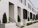 Charming townhome exterior features neat landscaping, symmetrical design, and eye-catching brickwork at 1303 Chamblee Hill Ct, Raleigh, NC 27608