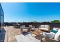 Spacious rooftop patio with comfortable seating and stunning city views at 1303 Chamblee Hill Ct, Raleigh, NC 27608