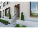Chic townhouse entrance featuring well manicured landscaping and contemporary architectural design at 1308 Chamblee Hill Ct, Raleigh, NC 27608