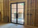 Interior view showcasing a black-framed glass door with a clear exterior view of the home at 1500 Ridge Rd, Raleigh, NC 27607