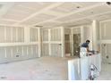 Spacious, unfinished room with drywall, presenting a blank canvas for customization and design possibilities at 17 Spring Crest Dr # 68, Angier, NC 27501
