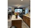 Open-concept living space featuring a fireplace and seamless transition to the kitchen at 204 Plank Bridge Way, Morrisville, NC 27560