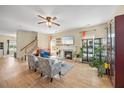 Cozy living room with hardwood floors, a fireplace, a flatscreen, and comfortable seating arrangement at 2429 Follow Me Way, Raleigh, NC 27610