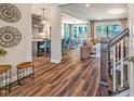 Open-concept living space showcasing hardwood floors, a kitchen island, and a seamless flow for modern living at 269 Ivy Ridge Rd, Chapel Hill, NC 27516