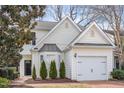 Charming home featuring a brick driveway, cream siding, a bay window and attached garage at 2728 Cherry Field Dr, Raleigh, NC 27603