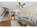 Inviting living room with hardwood floors, a decorative rug, and an open floor plan concept at 2821 Wilshire Hill Dr # 111, Raleigh, NC 27604