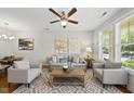 Bright living room featuring neutral tones, stylish decor, and a large window for natural light at 2821 Wilshire Hill Dr # 111, Raleigh, NC 27604