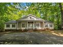 Classic brick and white home with a symmetrical facade and inviting entrance at 2901 Horse Shoe Farm Rd, Wake Forest, NC 27587