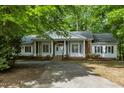 Elegant one-story home with a white facade and well-manicured lawn at 2901 Horse Shoe Farm Rd, Wake Forest, NC 27587
