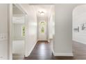 Inviting foyer features hardwood floors, arched doorways, and a view of a room filled with natural light at 315 Copper Ridge Dr, Sanford, NC 27330