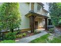 Inviting front porch with wooden beams, offering a warm welcome to this charming home at 419 Travertine Dr, Cary, NC 27519