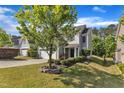 Charming two-story home featuring a two-car garage, manicured lawn, and mature landscaping at 4727 Smarty Jones Dr, Knightdale, NC 27545