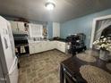 Functional kitchen with ample cabinet space, modern appliances, and a cozy dining area at 514 E Lee St, Smithfield, NC 27577