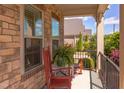 Cozy front porch featuring brick columns, rocking chairs, and a charming view at 5144 Niagra Dr, Chapel Hill, NC 27517