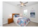 Bright bedroom with a plush bed, wooden nightstands, and a calming view from the window at 73 Windswept Way, Fuquay Varina, NC 27526