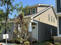 Side view of a craftsman home featuring two tone siding and a covered front porch at 901 Linwood Ave, Durham, NC 27701