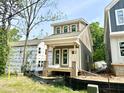 New construction home with gray siding and a covered porch at 901 Linwood Ave, Durham, NC 27701