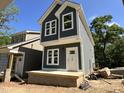 A lovely two-story new home showcasing gray siding, bright white trim, and a sturdy foundation at 903 Linwood Ave, Durham, NC 27701