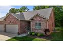 Beautiful brick home with well-maintained lawn and manicured landscaping at 928 Arrowhead Ln, Mebane, NC 27302