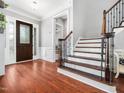 Inviting foyer with hardwood floors and a staircase leading to the upper level at 948 Uprock Dr, Cary, NC 27519