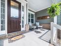 Cozy front porch with seating, perfect for relaxing and enjoying the outdoors at 948 Uprock Dr, Cary, NC 27519