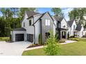 Modern two-story home with a two-car garage, well-maintained lawn, and inviting curb appeal at 949 Harrison Ridge Rd, Wake Forest, NC 27587