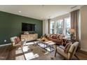 Bright, sun-filled living room with stylish decor and a comfortable leather sofa at Lot 6 Cooper St, Sanford, NC 27330