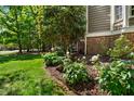 Well maintained landscaping with blooming flowers and lush greenery around the house at 101 Abbotsford Ct, Durham, NC 27712