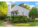 Charming white home with lush landscaping and prominent chimney at 101 Pickett Ln, Cary, NC 27511