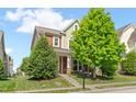 Charming two-story home with a well-manicured lawn and inviting front porch at 1016 Pemberly Ave, Morrisville, NC 27560