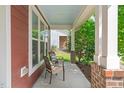 Relaxing porch featuring chairs and a view of a well-maintained yard at 1016 Pemberly Ave, Morrisville, NC 27560