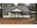 Exterior of a cozy single-story house, showcasing the front porch and classic design at 107 E Underwood Ave, Smithfield, NC 27577