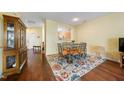 Bright dining area featuring hardwood floors and an ornate hutch at 1204 Maroon Dr, Durham, NC 27713